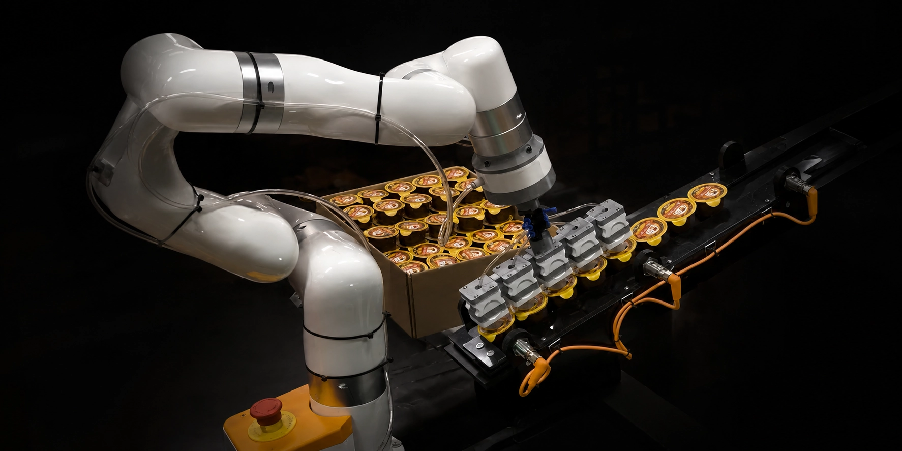 UFACTORY cobot with a multi-cup vacuum gripper placing rows of sealed portion cups into a cardboard case