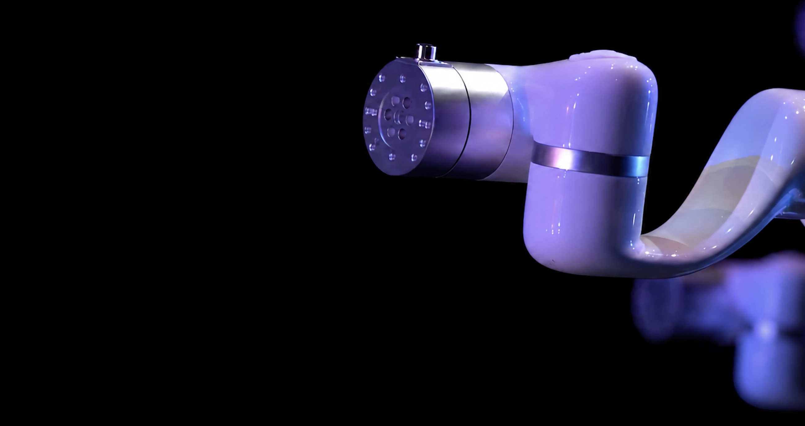 Close-up of an xArm cobot under stage lighting in an interactive art installation