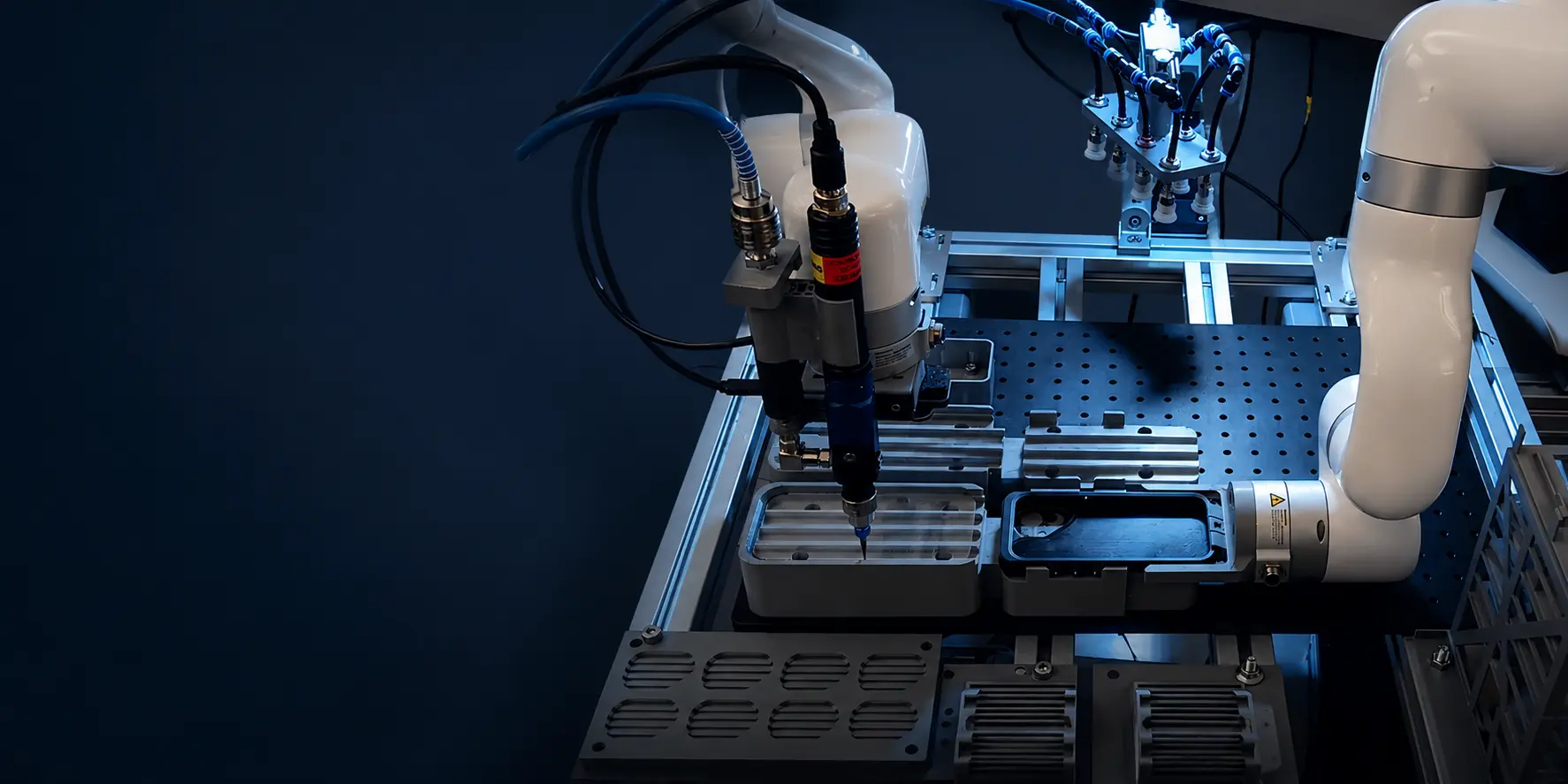 UFACTORY cobot with a dispensing valve applying adhesive to a phone enclosure in a bonding workcell