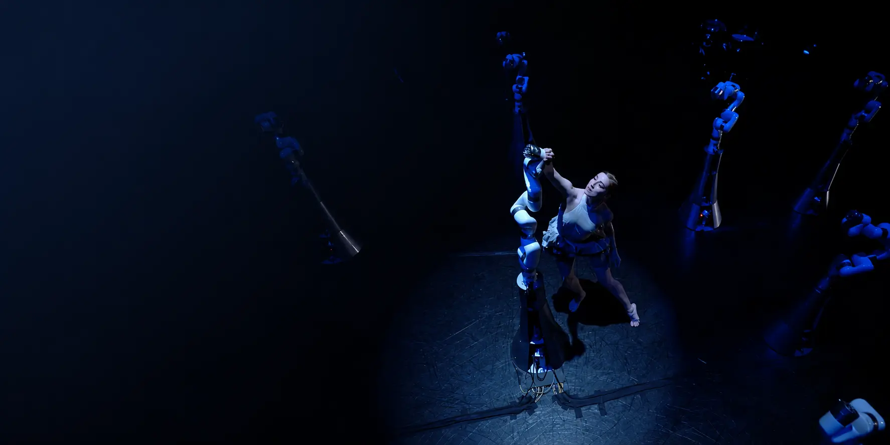Dancer performs among multiple xArm cobots in an immersive human-robot art installation