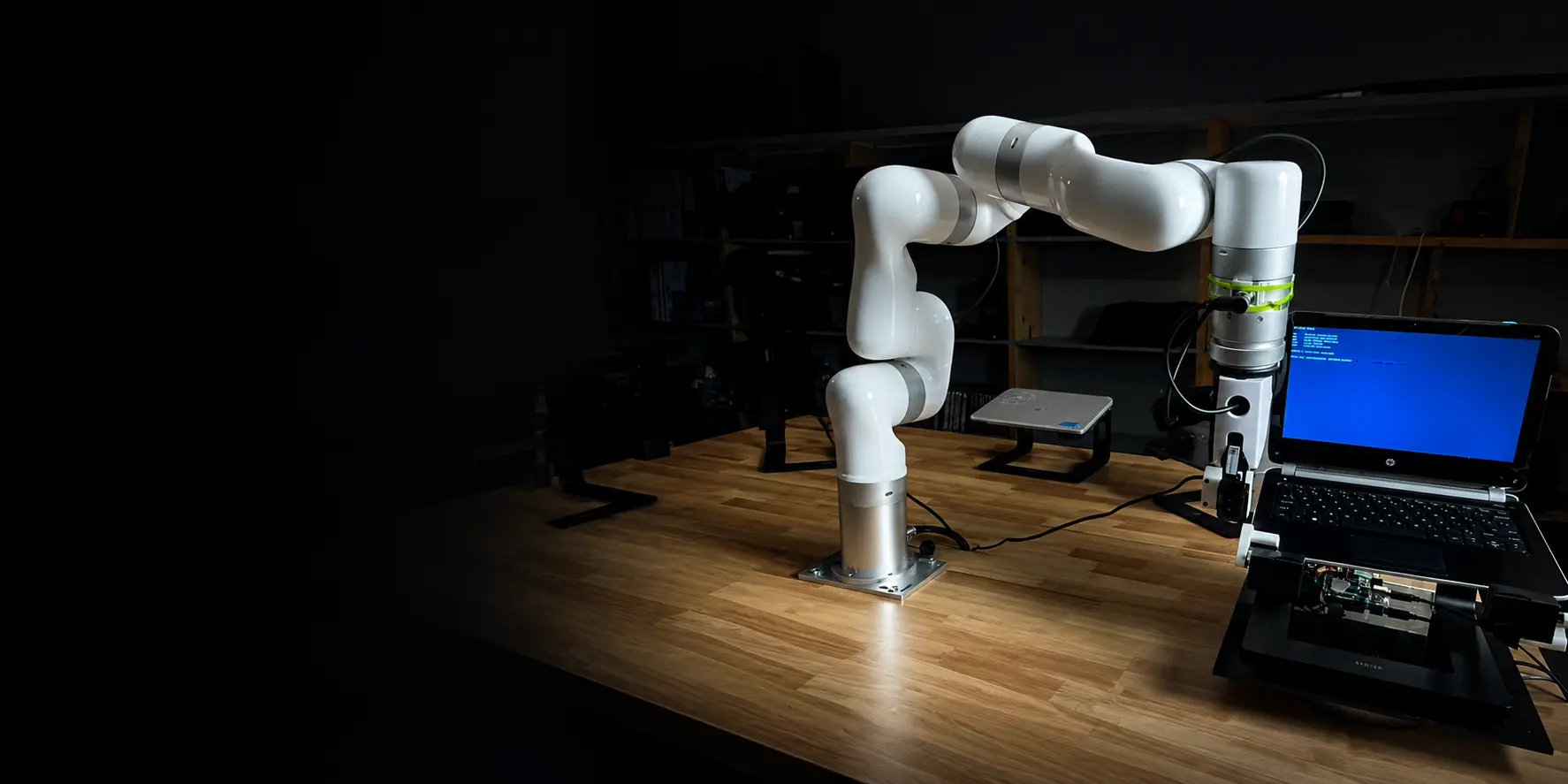 UFACTORY cobot positioned at an inspection workstation with a laptop running a test sequence