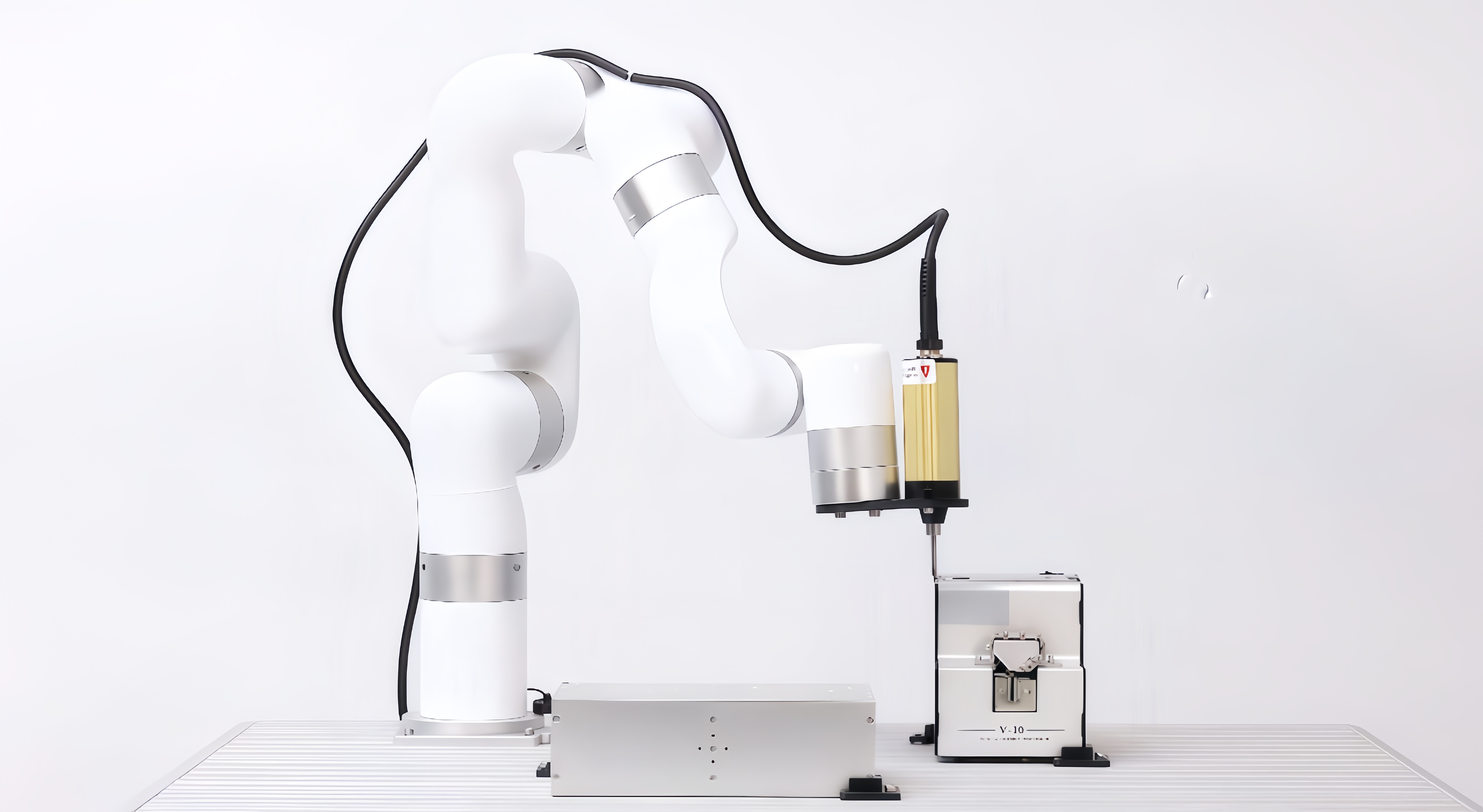 UFACTORY cobot with an electric screwdriver reaching toward a screw feeder in an automated fastening setup