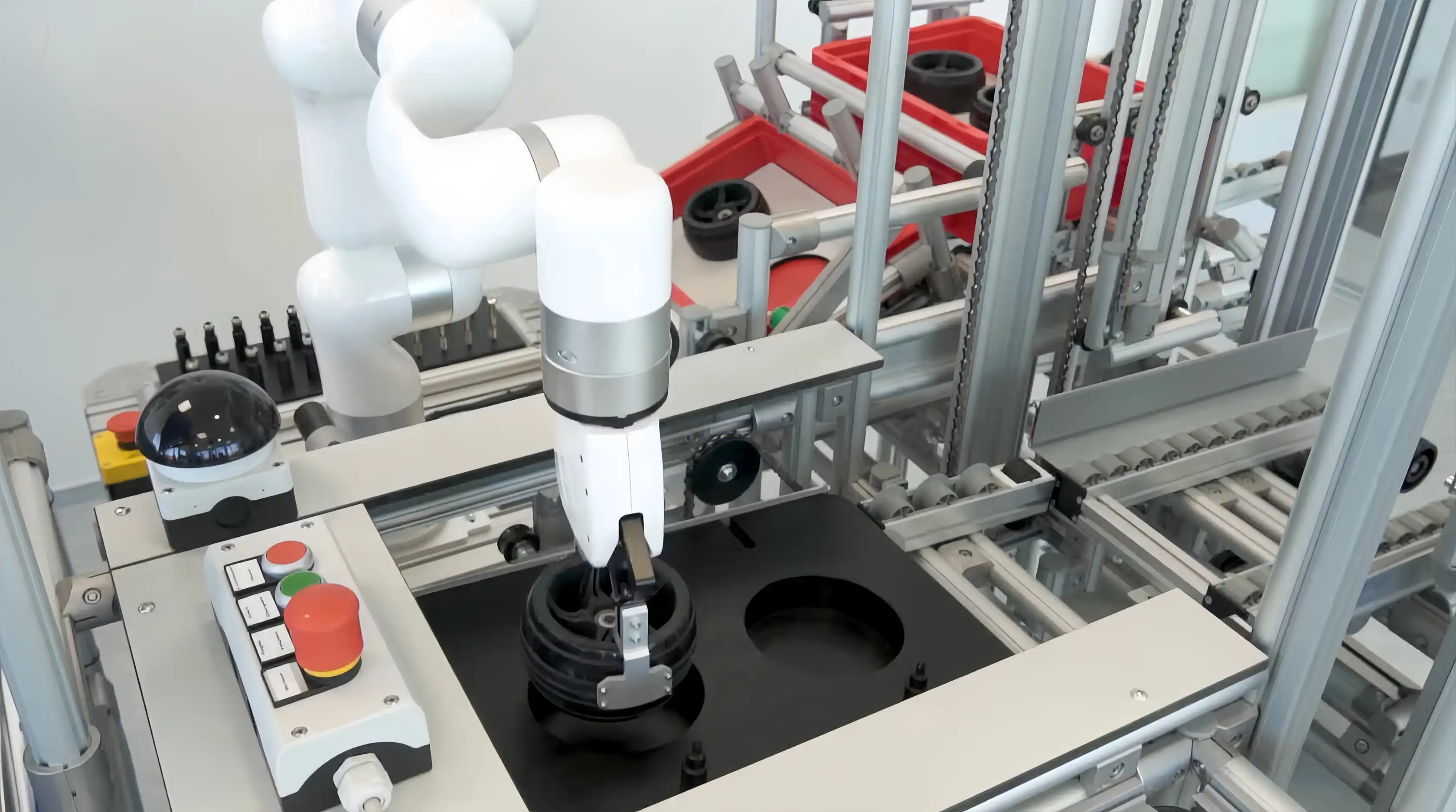 xArm collaborative robot manipulating a part over a designated slot during a Karakuri Kaizen demonstration