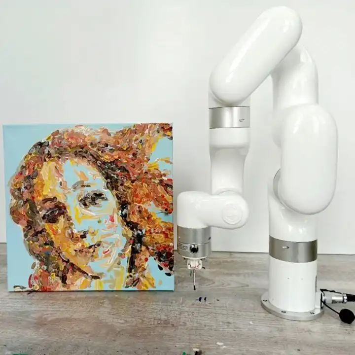UFACTORY xArm painting robot beside a finished portrait