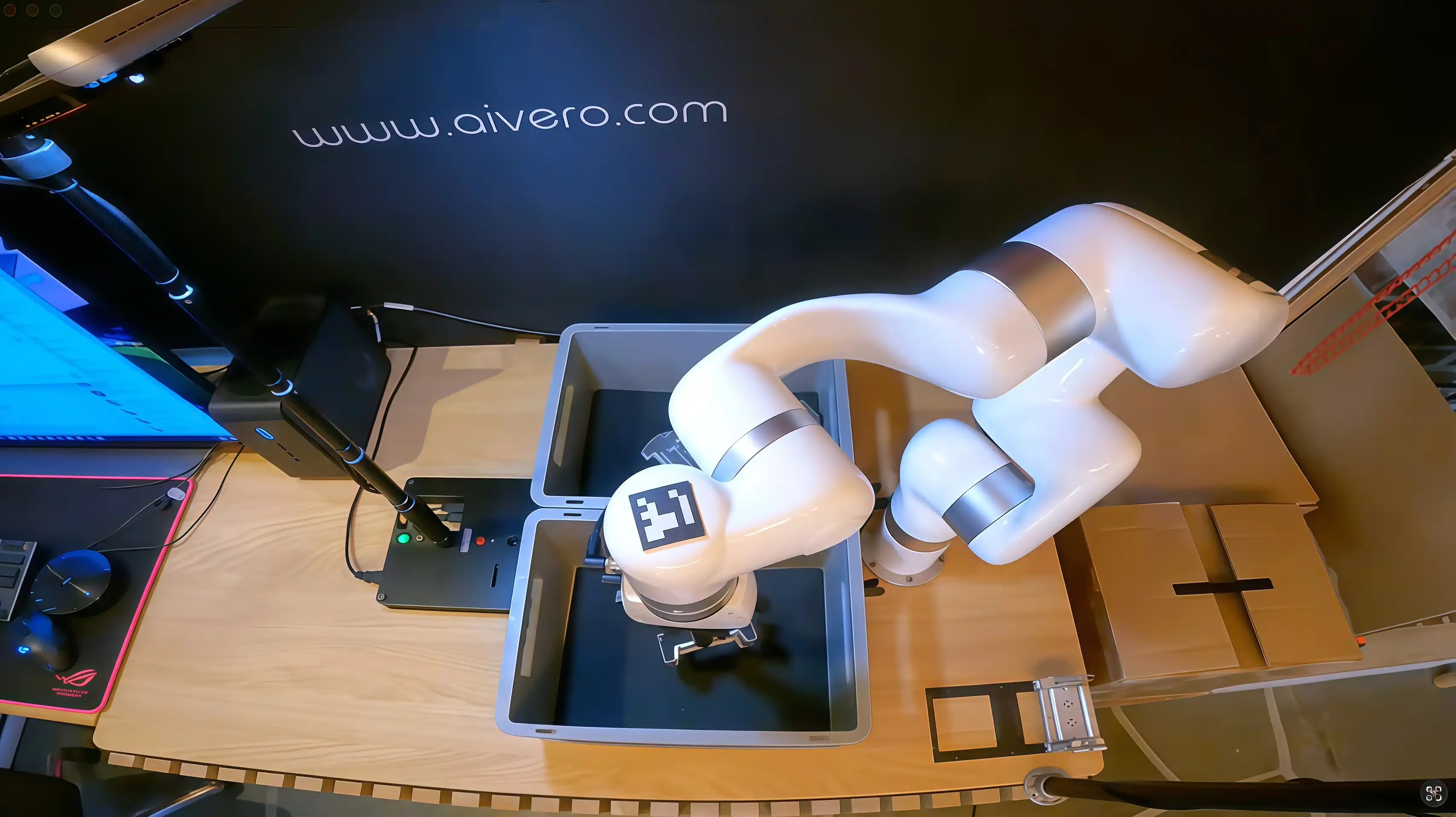 xArm 6 transfers a metal part into the destination bin during an Aivero 3D vision bin-picking cycle