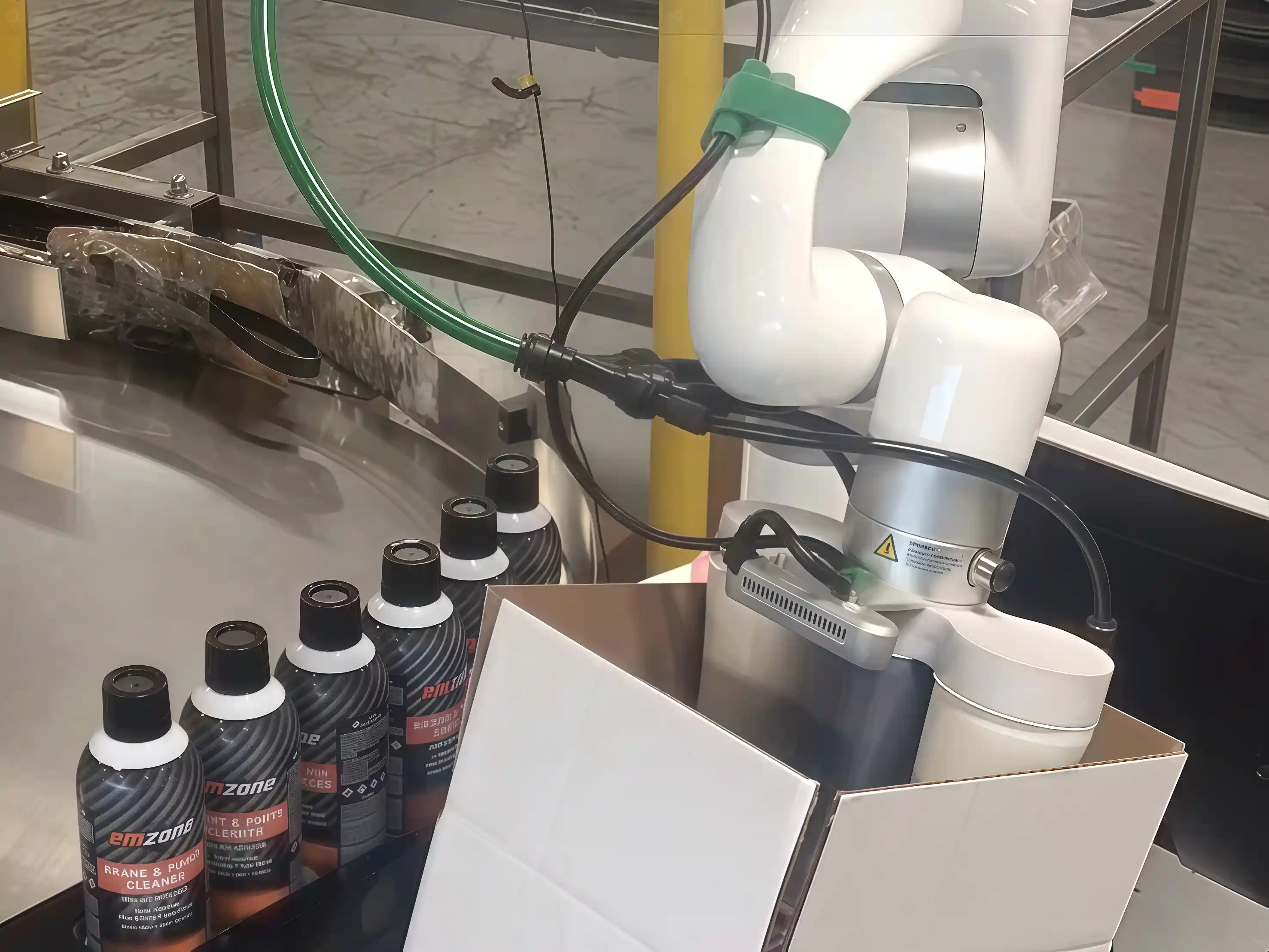 UFACTORY xArm cobot with a vacuum gripper picks bottles and packs them into a cardboard shipping box