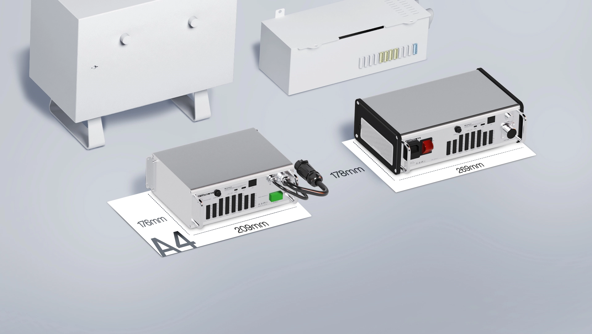 UFACTORY AC and DC control boxes shown on A4 paper for scale, next to a conventional full-size control cabinet.